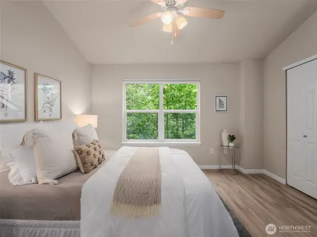 Private views and natural light from primary bedroom