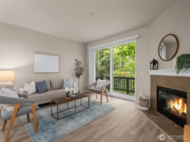 Living room and private deck with wood fire place