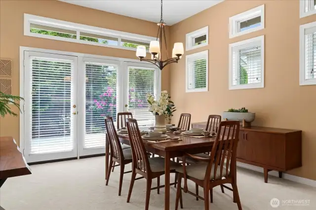 Casual dining area off kitchen offers pleasant views, and access to deck and fenced yard