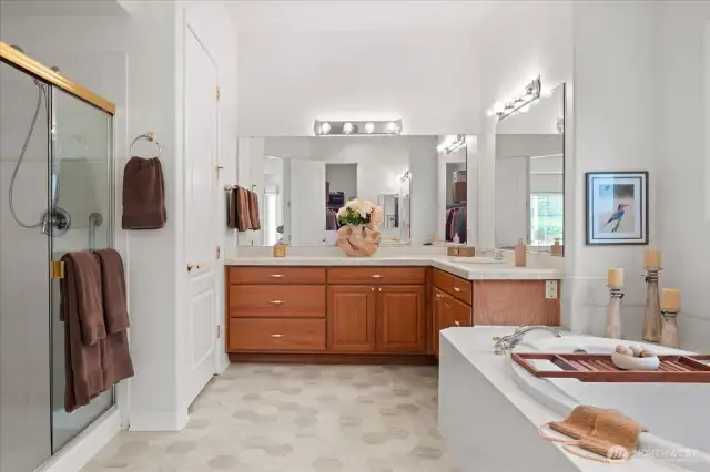 Considerable primary bath with soaking tub, double vanities, shower and private water closet