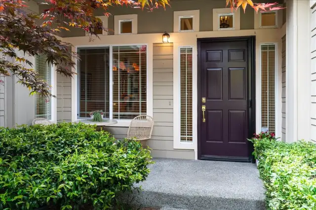 Perfect place to soak up the neighborhood or greet guests from this covered front porch