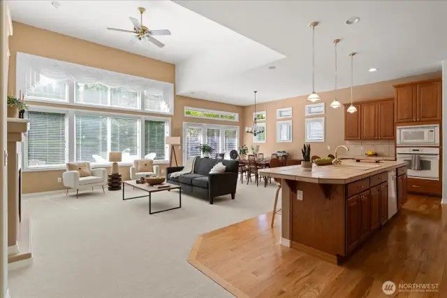 Inviting great room with glass wall and 14' ceilings, illuminating main living areas with natural light
