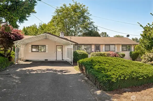 This rambler has a two car carport and plenty of additional parking in the driveway.