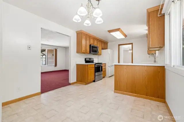 A view from the dining area looking back towards the kitchen and the living room.