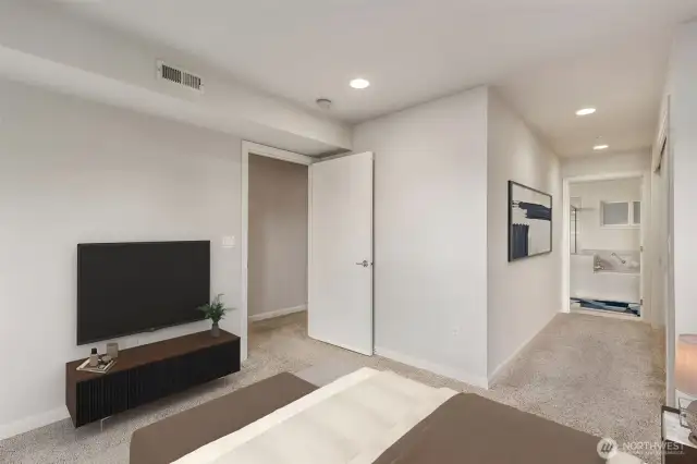 Large primary bedroom with attached full  bathroom.