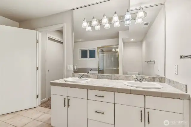 Primary 5 pc. bathroom with double sinks,  soaking tub & full tile walk-in shower.