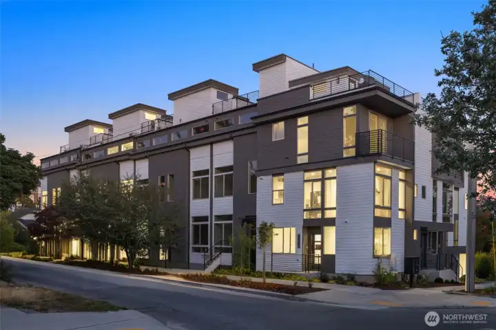 Street-level perspective of Arlo’s architecture, blending sharp modern lines with natural textures for lasting curb appeal.
