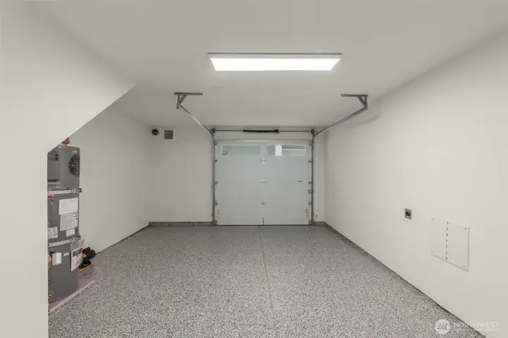 Photos of Model Home. Spacious garage with room for parking and storage, thoughtfully designed and EV-ready for modern convenience.