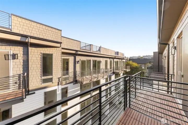 Bedroom balcony perspective shows generous square footage, perfect for a morning coffee.
