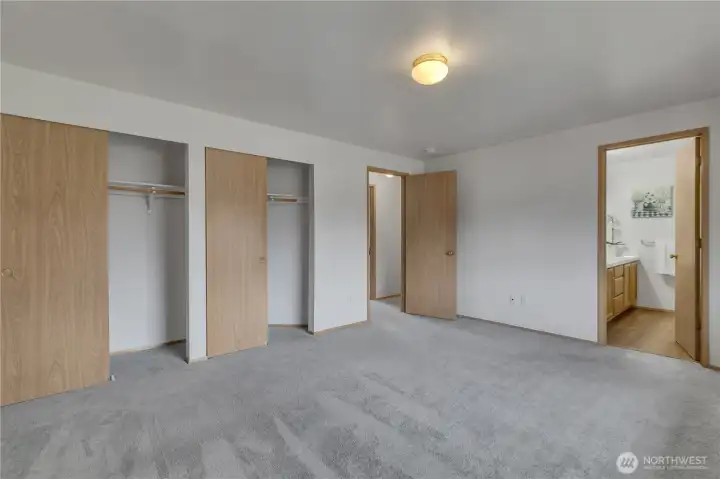 Primary suite with double closets and ensuite bath,