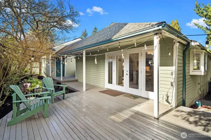 French doors lead to back deck, ready for entertaining or relaxing