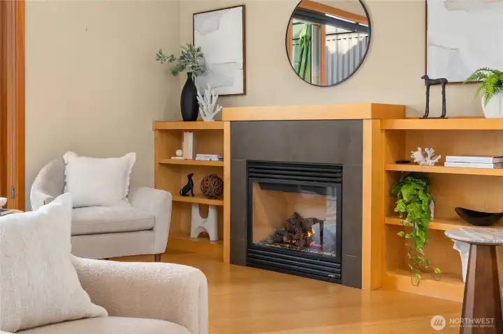 Enjoy the cozy and easy to use propane fireplace with lovely built in wood bookcases.