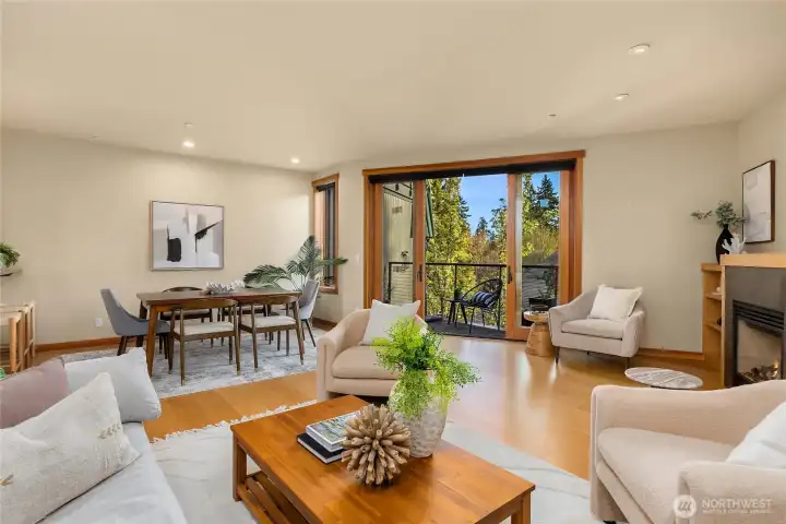 Large glass sliding doors and adjoining windows bring in natureal sunshine.