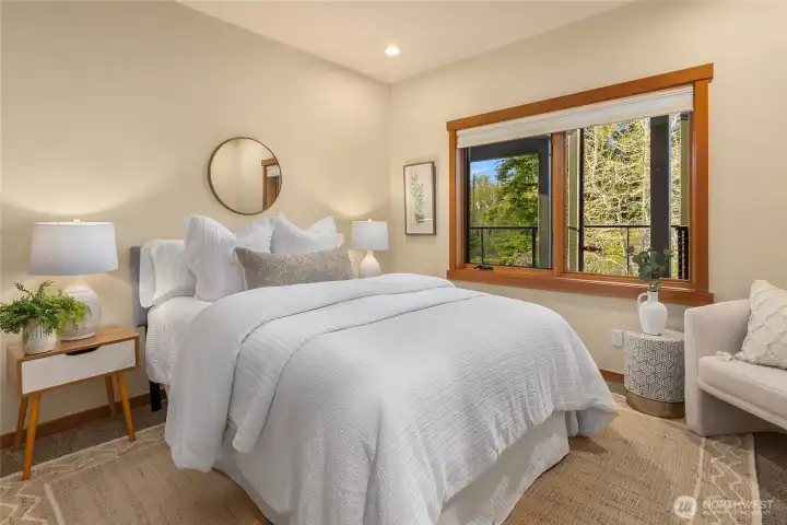 Main floor bedroom is spacious and bright. 3/4 bath is across the hall.