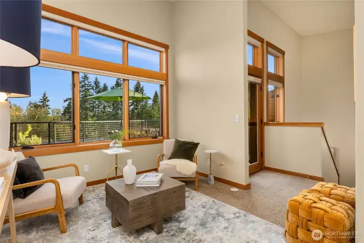 The second story greats you with an open den/home office show casing large windows and vaulted ceiling.