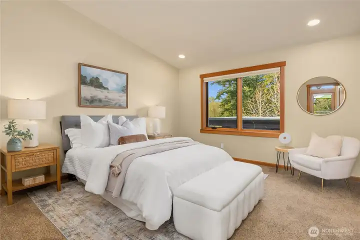 The primary suite is on the upper level and features an en-suite full bath and walk-in closet.