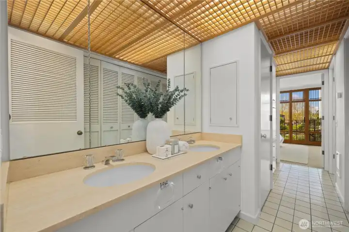 Primary bathroom/closet with ample storage.