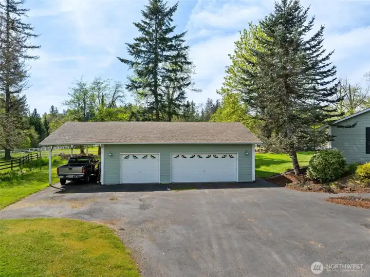 Detached 3 car garage with carport