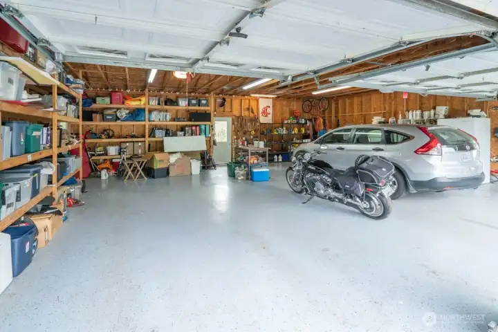 Garage with epoxy flooring and shelving