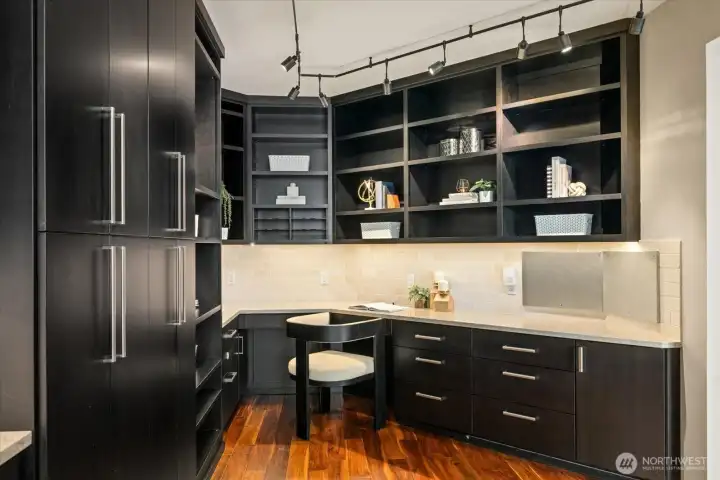 Another flexible space that allows for a built in work station complete with custom cabinets and shelving.