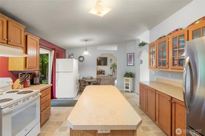 Center island, pantry and tons of cabinet storage. Extra fridge with doors to side deck.