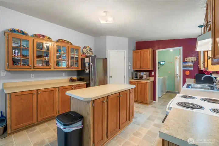 Kithcen with pantry,  and next to good sized laundry/utiliity area.