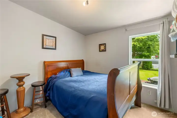 Guest bedroom with valuted ceilings.