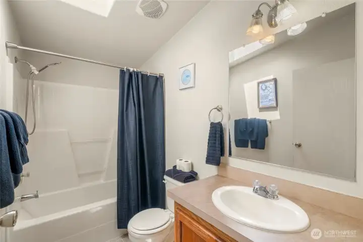 Second bath with skylight.