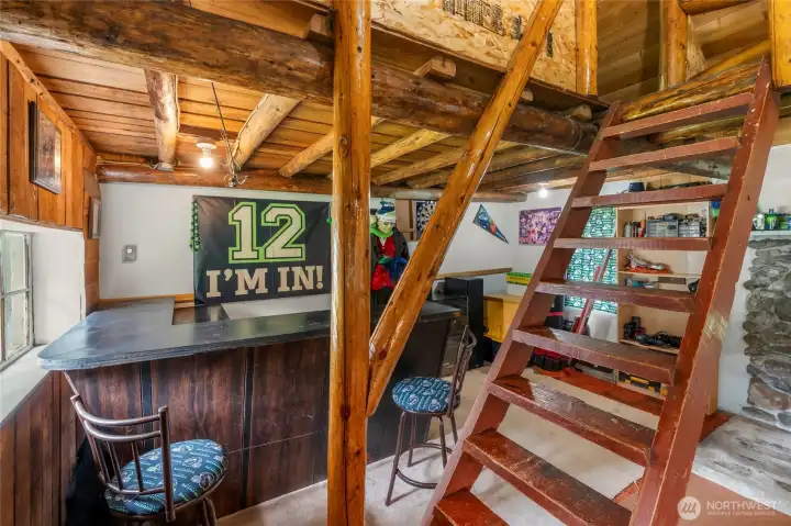 Fun loft style cabin with bar and fireplace creates a great game-day area or party room!