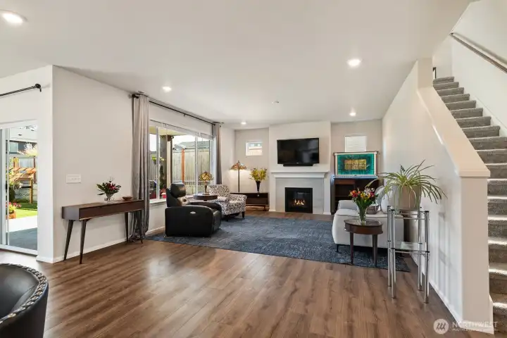 9ft Ceilings throughout main level - open concept living room with gas fireplace.