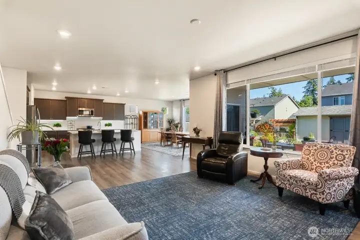Great flow through the living room. Oversized windows to soak in the backyard lush views.