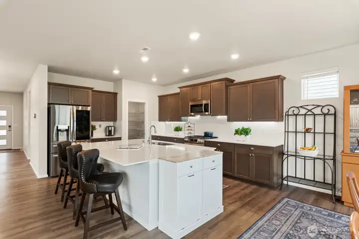 Centered sink and dishwasher in the island.