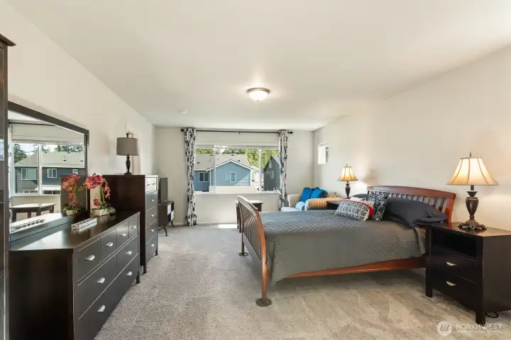 Oversized primary bedroom with sitting area.