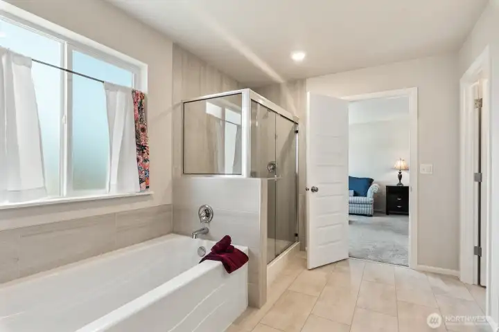 Barely used soaking tub and shower! This home lives like new construction but better!