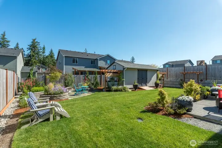 Not a blade of grass out of place - meticulously designed and maintained by the homeowners this backyard is a true oasis!