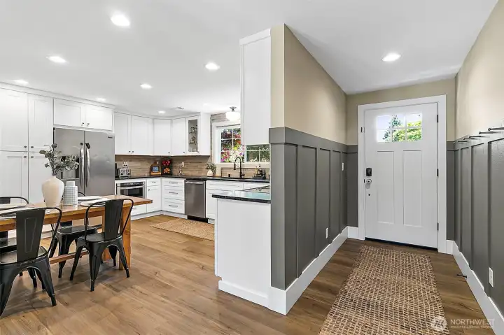 Beautiful entryway that opens up to the new kitchen and living area. Beautiful entryway that opens up to the new kitchen and living area.