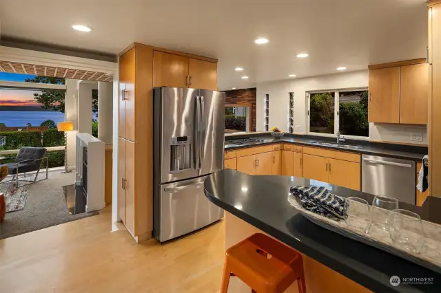 This shot highlights the flow between kitchen and living space.
