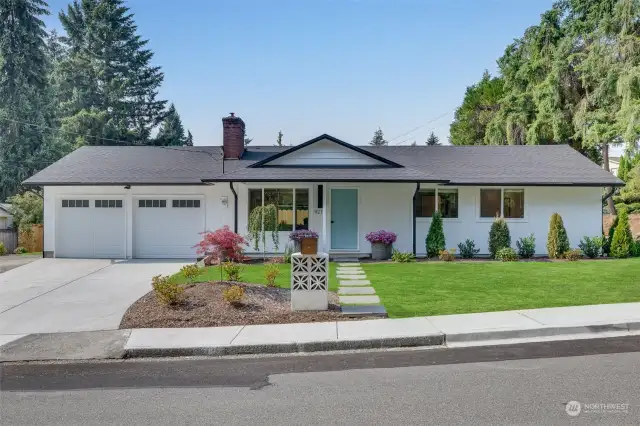 NEW...roof, windows, garage doors, driveway, paint, landscaping, vintage mailbox. Grass has been retouched by photographer.