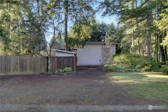 RV parking and car gate into backyard