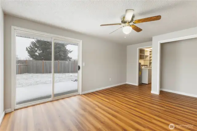 2nd Bedroom with doors leading to spacious backyard.