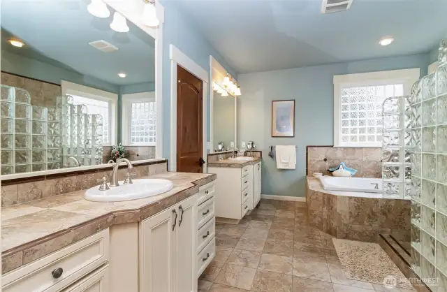 Primary Bathroom~Dual Vanities~Separate Water Closet~Heated Flooring~Glass Block Accents~
