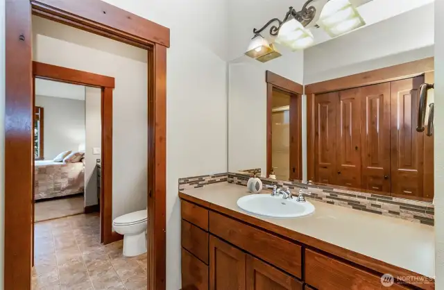 "Jack & Jill" Bathroom Serves the Two Secondary Bedrooms~Separate Vanities & Closets~Shared Toilet & Shower~