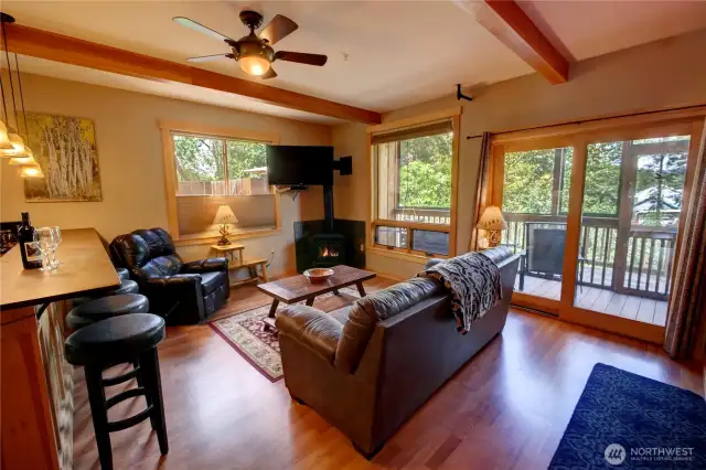 You can see your private porch through the living room-  that leads straight out to the path behind the lodge that takes you to the river.