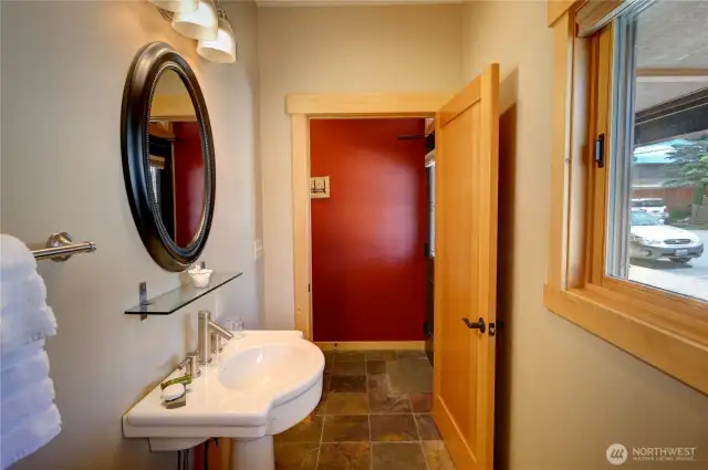 This half bath is just off the main entrance.  The main entrance to suite 101 is located off of Twisp Ave W.  You enter into a hallway and a half bath and stacked washer dryer is on your left hand side upon entry.