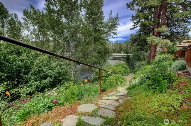 Safety rail lines the gently sloped stone walkway to Twisp River.