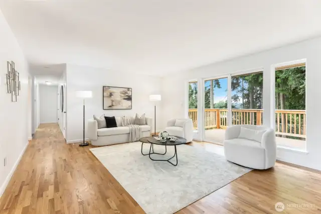 Stunning refinished hardwoods throughout the main floor, including in the beautiful living room! The bedrooms and main floor bath are down the hallway. Deck and backyard access out the sliding door.