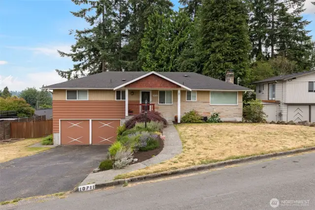 Front of home with two car garage and room for more parking in the driveway. Room for a trailer as well!