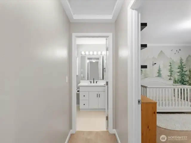 Hall leading to bedrooms and full bathroom