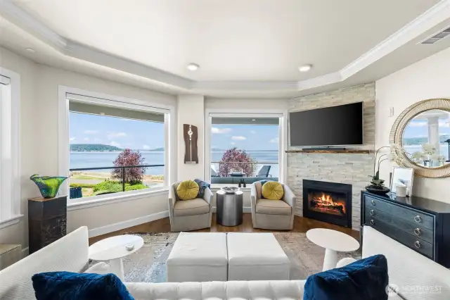 Your living area has a cozy gas fireplace, full height surround and live edge mantle. Coffered ceilings and crown molding add a lovely finish touch.