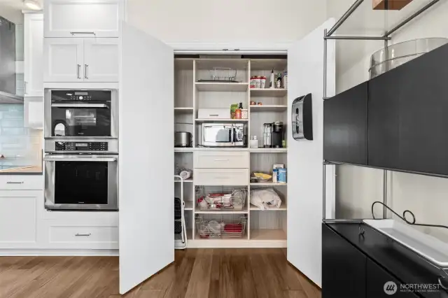 So much storage with the cabinets and pantry. Even enhanced shelving in the pantry including drawers